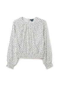 Witte kinderblouse met lange mouwen, voorzien van een zwart onregelmatig stippenpatroon, elastische manchetten en een gathered elastische zoom.