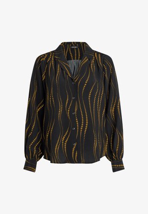 Schwarze Bluse mit langen Ärmeln, Knopfleiste und einem gewellten gelben Punktmuster. Weiches Material mit Kragen und gerafften Details.