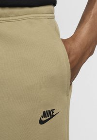 Nike Sportswear SPORTSWEAR TECH FLEECE - Tracksuit bottoms - neutral olive black