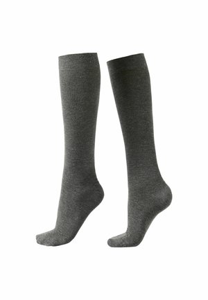 Par de calcetines altos hasta la rodilla de color gris oscuro mostrados uno al lado del otro, uno ligeramente levantado en el talón, textura lisa sobre fondo blanco.