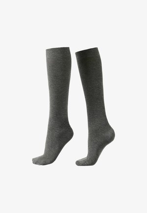Par de calcetines altos hasta la rodilla de color gris oscuro mostrados uno al lado del otro, uno ligeramente levantado en el talón, textura lisa sobre fondo blanco.