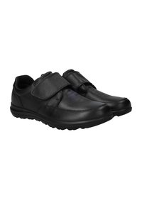 Zwarte leren schoenen met een ronde neus, voorzien van een enkele verstelbare klittenband en een gewatteerde kraag voor comfort. Rubberen buitenzool voor grip.