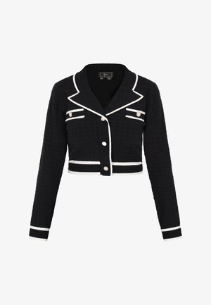 Rövidített fekete kardigán fehér részletekkel, kihajtható gallérral, gombos elülső résszel és két mellzsebbel, díszgombokkal. Texturált anyag.