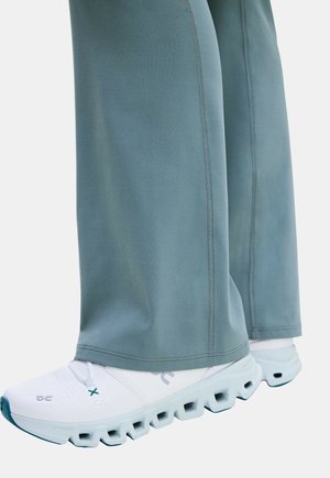 On, STUDIO FLARED PANTS 30" - Legging (type pantalon) - agave