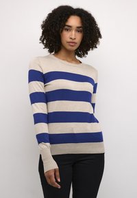 Striped knit sweater in beige and navy blue. Features a crew neckline, long sleeves, and a slim fit. Fabric is soft with ribbed cuffs.