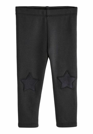 Schwarze Leggings mit einer glatten Textur, ausgestattet mit zwei dunklen Sternapplikationen an den Knien und einem bequemen, elastischen Bund.
