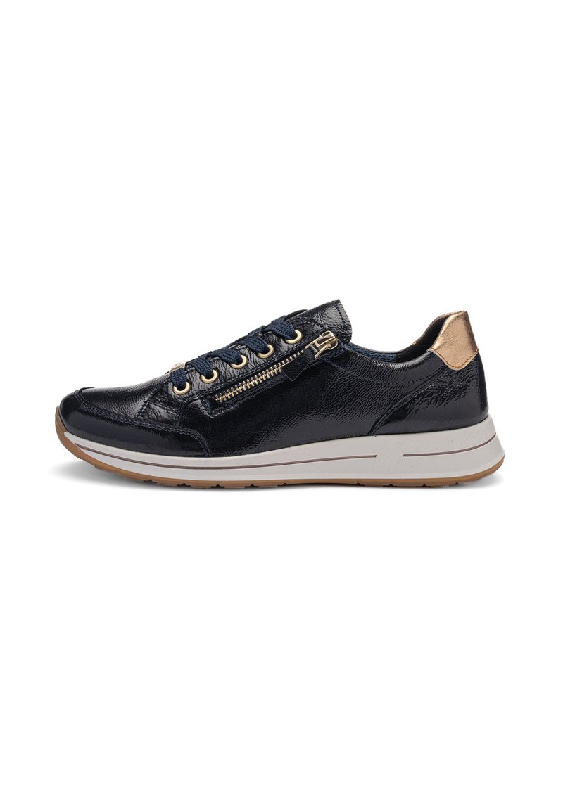 Black leather sneaker with gold zipper and eyelets, matching gold heel accent, white sole, and brown outsole, shown in side profile.
