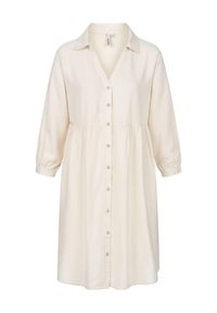 Linnedress i off-white, med knäppning fram, krage och trekvartslånga ärmar med elastiska manschetter. Samlad midjedetalj.