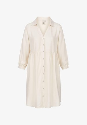 Abito in lino di colore avorio, con chiusura a bottoni sul davanti, colletto e maniche a tre quarti con polsini elastici. Dettaglio in vita arricciato.