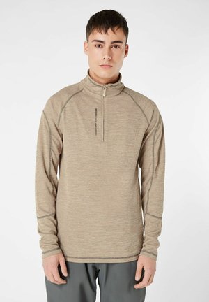 Camicia beige zip-up a maniche lunghe con vestibilità slim, tessuto testurizzato, cuciture a contrasto e colletto alto con zip corta.