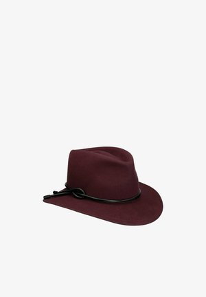 Burgundy felt fedora hat with a black leather cord tied in a knot around the base of the crown.