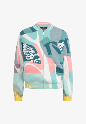 Brede gebreide bomberjack met een kleurrijk bloemenpatroon in teal, roze en crèmekleurig. Geribbelde gele manchetten en kraag, met een rits aan de voorkant.