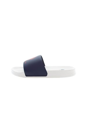 Mörkblå halksandal med bred överrem, vit texturerad sula och logodetalj på remmen. Slät material, enkel design, platt form.