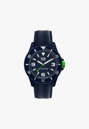 Navyblaues solarbetriebenes Armbanduhren mit strukturiertem Armband, großen weißen Stundenmarkierungen und einem grünen Akzent auf der Krone. Wasserdicht bis 10 ATM.