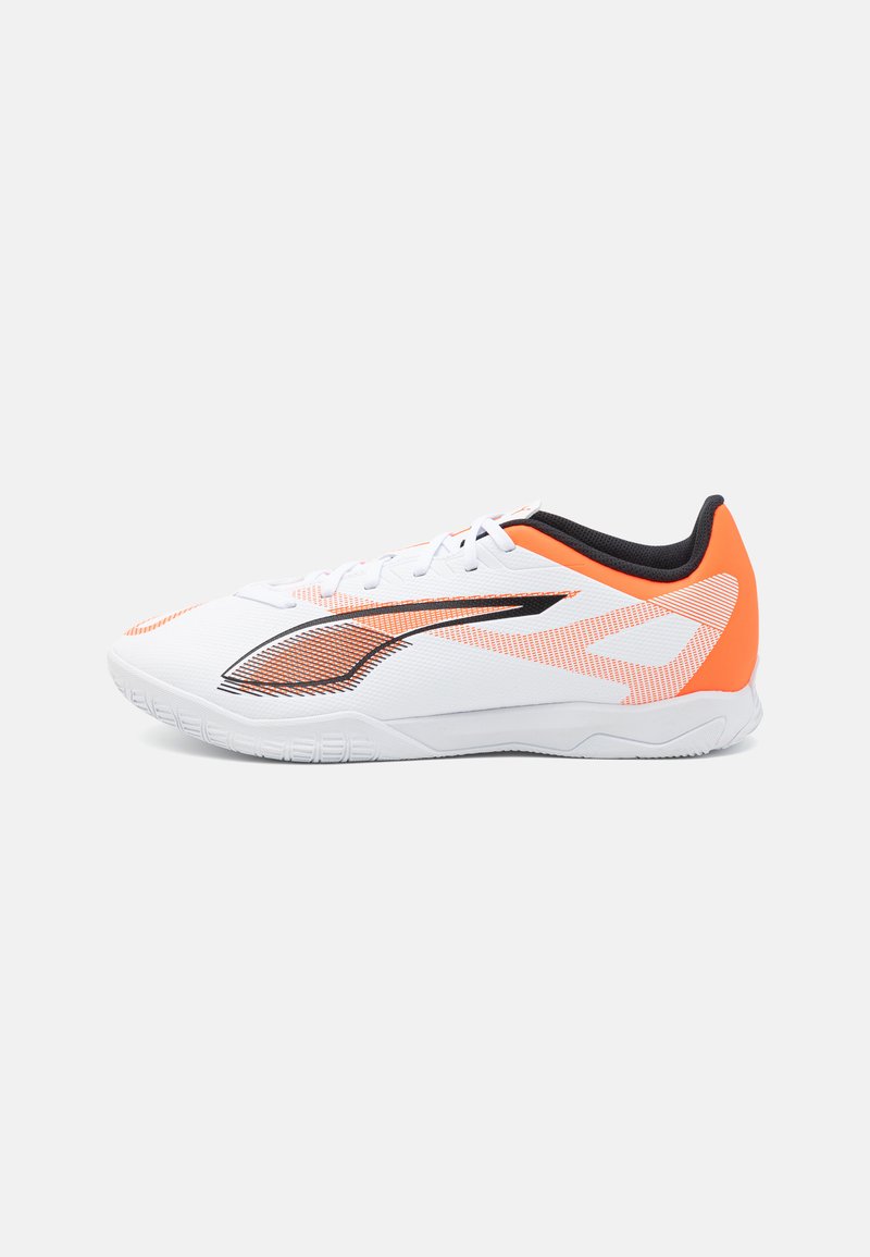 White athletic shoe with orange and black accents. Features a textured upper, a sleek design, and a rubber sole for traction.