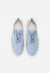Light blue sneakers made of suede with a perforated design, featuring lace-up closure and a side zipper for easy access.