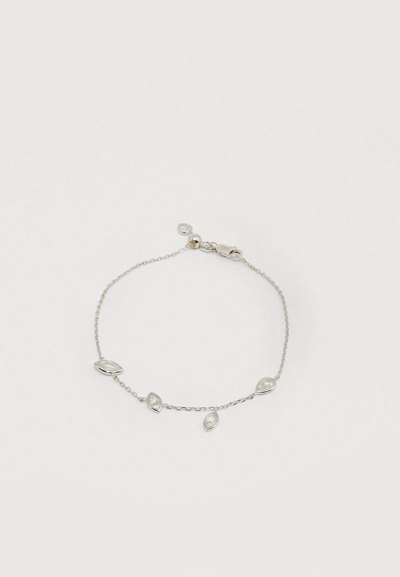 Pulseira de corrente prateada com acabamentos alternados em forma de marquise e gota de cristal transparente, com fecho de lagosta seguro.