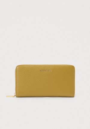 Yellow textured leather zip-around wallet with gold-tone zipper pull and COCCINELLE logo embossed on the front center.