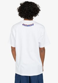 White short-sleeve t-shirt made of cotton, featuring a colorful "ELEMENT" graphic in a stylized font on the back.