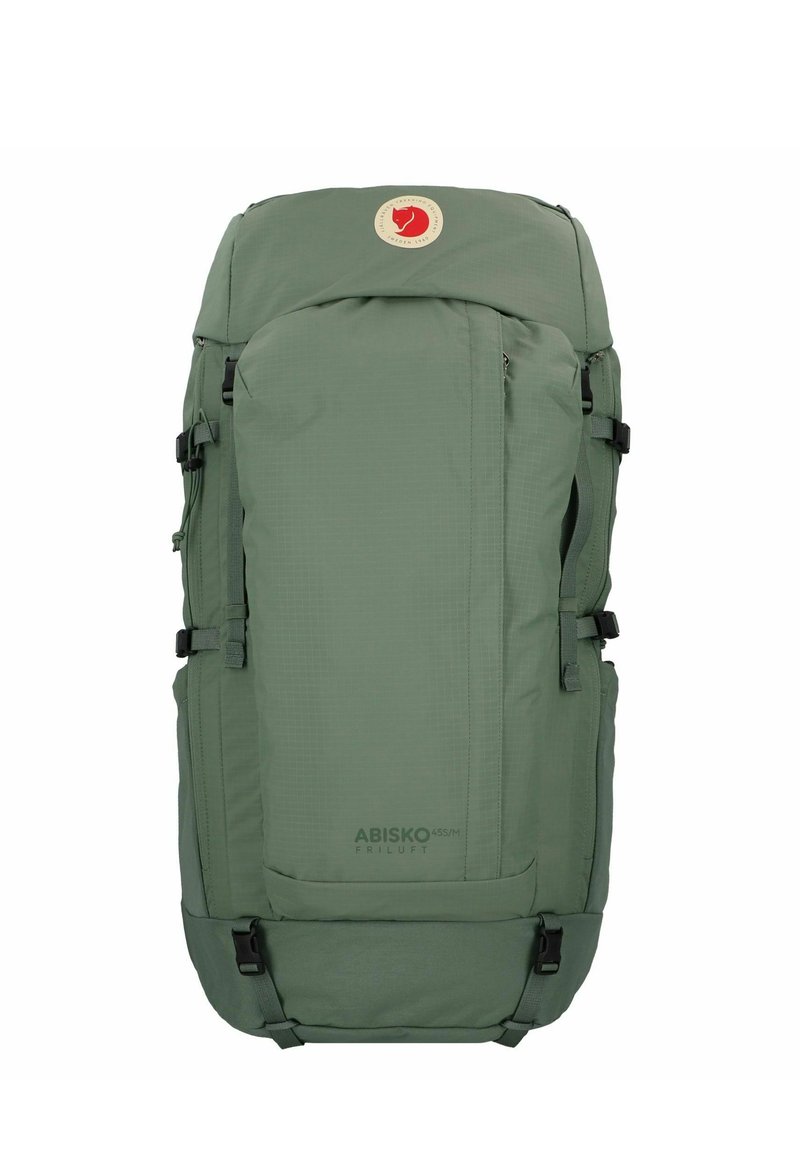 Zöld, téglalap alakú hátizsák, tartós anyagból készült. Állítható hevederekkel, csatokkal és egy kerek logóval rendelkezik a tetején.