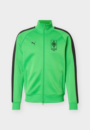 Jachetă sport cu fermoar de culoare verde aprins, cu dungi negre pe mâneci, logo-ul Borussia M.G. pe piept și logo-ul Puma pe partea opusă.