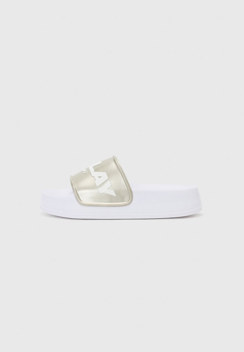 White slide sandal with a wide metallic gold strap featuring embossed letters. Soft-textured sole with a slight elevation for comfort.