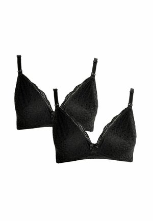 Deux soutiens-gorge sans armatures en dentelle noire avec bretelles réglables et petits nœuds décoratifs au centre devant, présentés sur fond blanc.