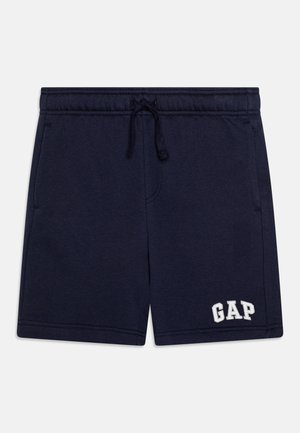 Granatowe szorty bawełniane z elastycznym pasem, sznurkiem do regulacji, bocznymi kieszeniami oraz białym haftowanym logo "GAP" na dolnym prawym brzegu.