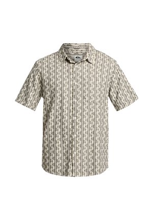 Chemise à manches courtes avec boutons, fond beige et motif vertical de vagues et feuilles géométriques en marron et noir.