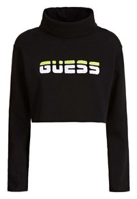 Sweatshirt noir court avec col montant, arborant le mot « GUESS » en lettres multicolores : blanc et jaune vif à l'avant.