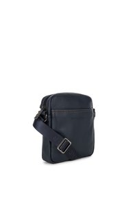 Navy leather crossbody bag with a smooth texture, rectangular shape, zip closure, and adjustable strap featuring a metal buckle.