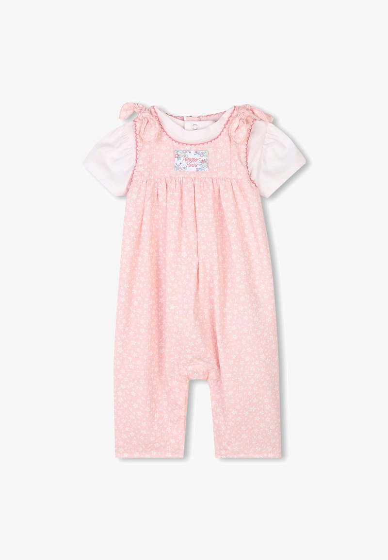 Romper con stampa floreale rosa e maniche corte bianche. Presenta dettagli con nastri sulle spalle e un'etichetta con il design "Romper Pants".