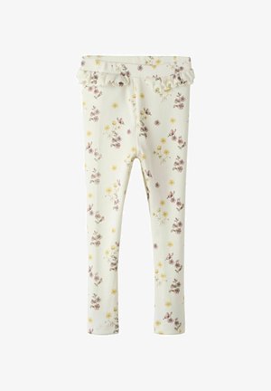 Witte leggings versierd met kleine paarse en gele bloemen, voorzien van een frivole tailleband. Ontworpen voor casual kinderkleding.