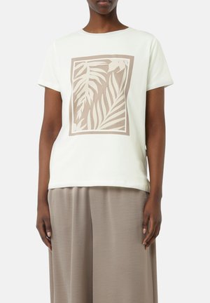 Hellgrünes, kurzärmliges T-Shirt mit einem beigen Blätterdesign in einem quadratischen Rahmen. Weicher Stoff mit lockerer Passform.