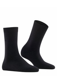 Schwarze Socken aus glattemstrickmaterial. Mit einem gerippten Bund oben, einer nahtlosen Zehenpartie und mittlerer Höhe.