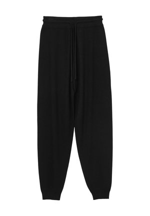 Schwarze Sweatpants aus weichem Material, mit einem Kordelzugbund, schmal zulaufenden Beinen und gerippten Bündchen an den Knöcheln.
