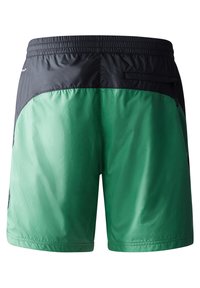 Shorts pour homme avec une taille et une partie supérieure noires. La partie inférieure est en tissu vert brillant. Comprend une poche arrière avec un détail zippé.