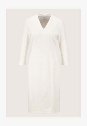 White knee-length dress with a v-neckline, long sleeves, and a smooth texture. Simple design with no visible patterns or embellishments.