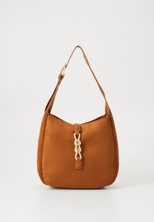 Pruun nahkmeenega õlakott, millel on kaardus kuju, kuldse kettakujundusega ja klapiga sulgur. Sile tekstuur, reguleeritav rihm.