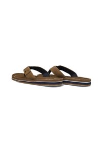 Brown flip-flops with a textured brown strap, dark blue accents, and a cushioned sole. Features a recessed logo on one strap.