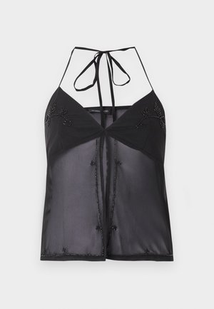 Haut noir transparent à col licou avec broderie florale perlée, fermeture à nouer au cou et design ouvert à l'avant.