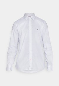 Camicia bianca a maniche lunghe con colletto button-down, caratterizzata da un piccolo motivo a pois blu e un sottile logo sul petto. Tessuto con superficie liscia.