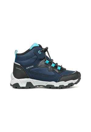 Chaussure de randonnée enfant bleu marine et noir avec des accents turquoise, semelle blanche robuste et système de laçage rapide.