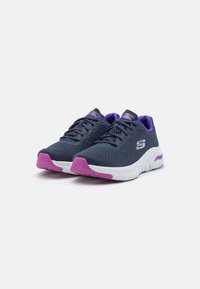 Gray athletic shoes with a mesh upper, purple accents on the tongue and collar, and pink details on the sole and toe cap.