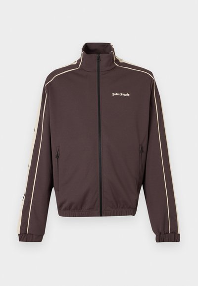 Σκούρο καφέ αθλητική ζακέτα με φερμουάρ, με μπεζ ρίγες στα μανίκια και το λογότυπο "Palm Angels" στο αριστερό στήθος.