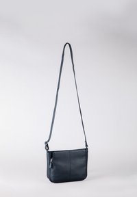Dark blue leather crossbody bag with a long adjustable strap, featuring a zip pocket on the side and smooth texture.