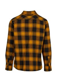 Kockás flanel ing, nagy fekete és sárga kockákkal, hosszú ujjakkal, gombos mandzsettákkal és hátsó yoke részlettel.