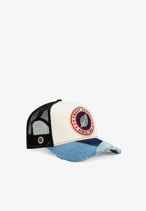 Casquette trucker avec dos en maille noire, panneau avant blanc, visière incurvée en patchwork de denim et écusson rond indiquant "Sweet Pants Since 1982" avec logo de feuille.