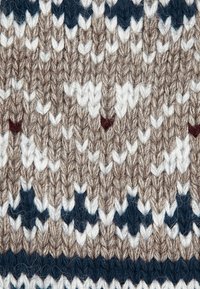 Tessuto a maglia con un motivo geometrico in tonalità di marrone, bianco e blu scuro, con una finitura morbida e testurizzata e vari disegni di punto.