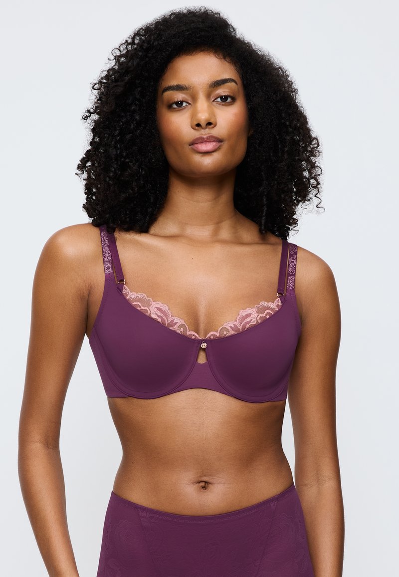 Bra in deep mauve with lace trim in soft pink, featuring a keyhole detail and adjustable straps with subtle floral pattern. Smooth fabric finish.